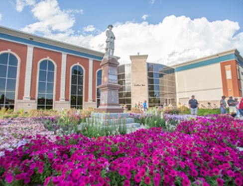 Flowers surrounding a statue