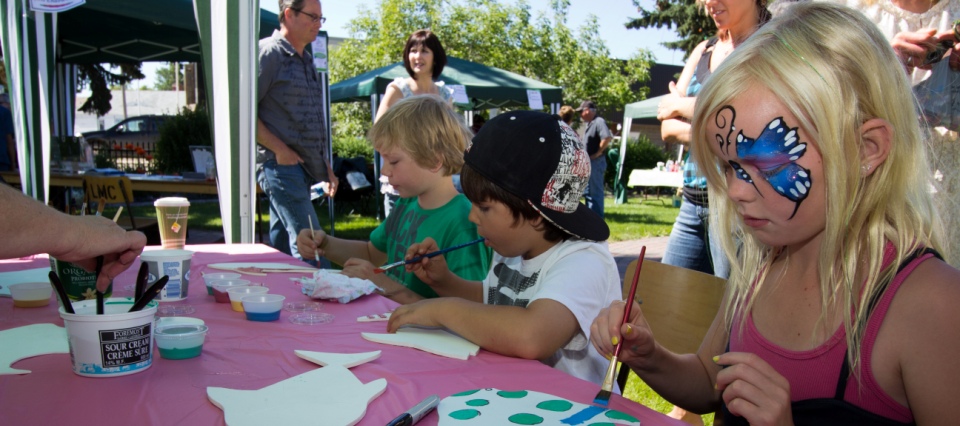 Kids Painting Arts and Crafts at a Fair